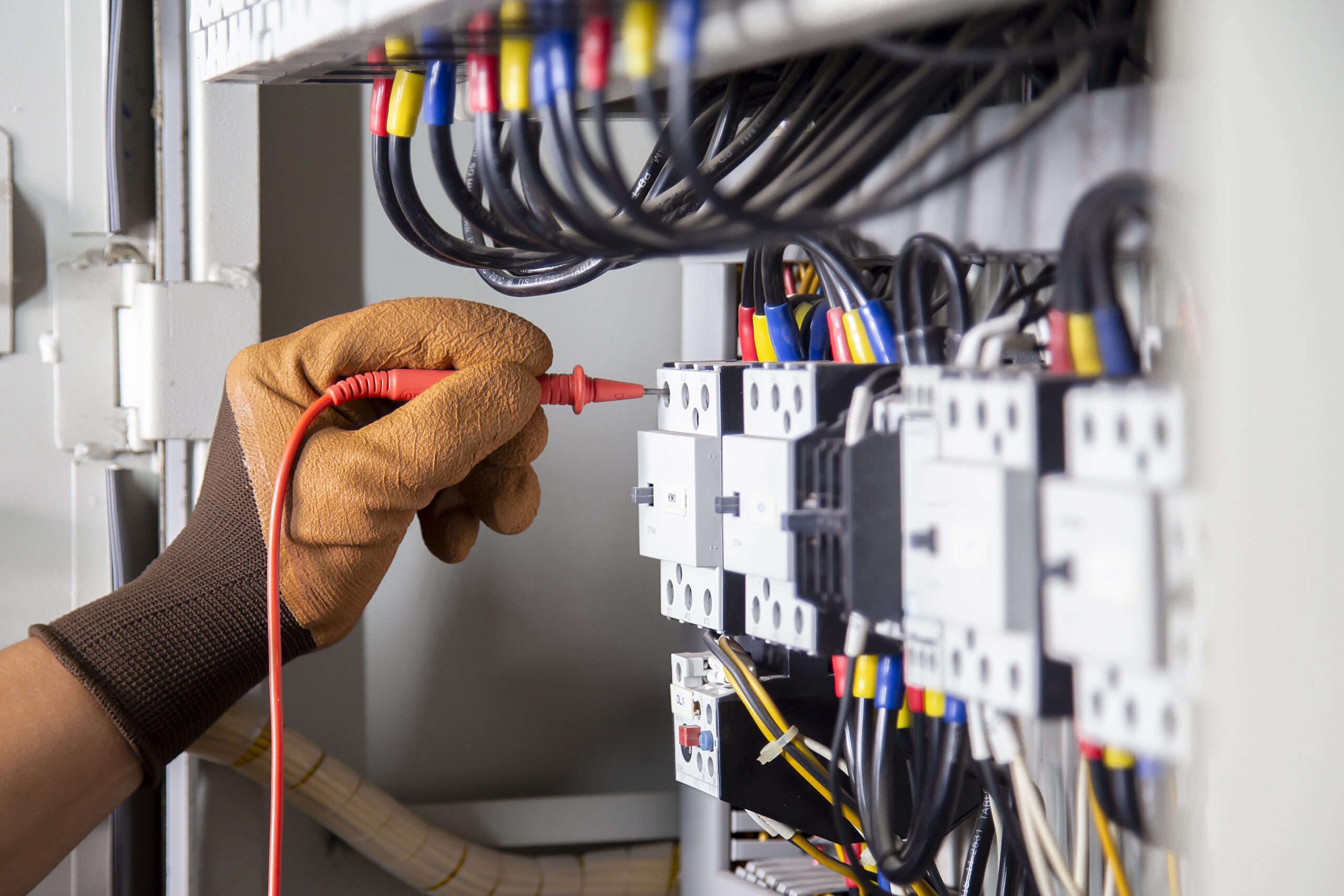 electrical-engineer-checks-electrical-system-by-measuring-with-multimeter electrical-engineer-checks-electrical-system-by-measuring-with-multimeter